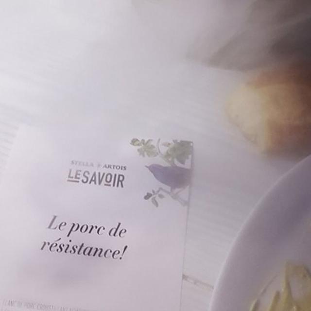 Close-up of a themed menu card at a Cirque du Soleil immersive dining experience, featuring artistic design and French text.